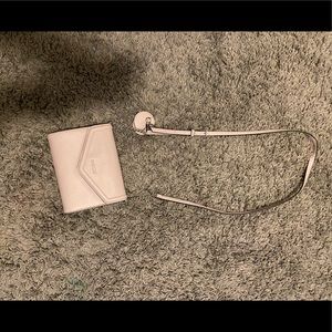Light purple over the shoulder purse, has little mirror attached.